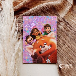 May include: A pink and purple illustrated card with a red panda and three cartoon characters. The card has the text "Hope to see you there! xoxo, Olivia".