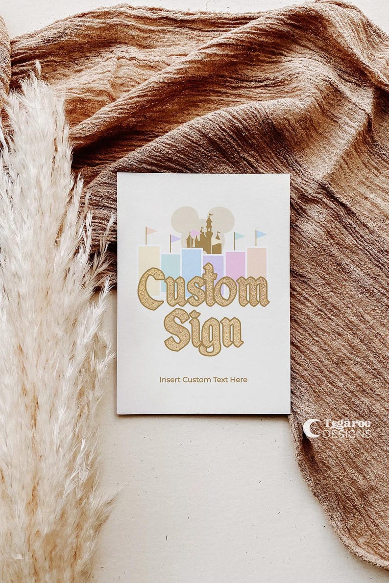 May include: A white card with a gold glitter castle silhouette and the text "Custom Sign" in gold glitter. The text "Insert Custom Text Here" is below the sign.