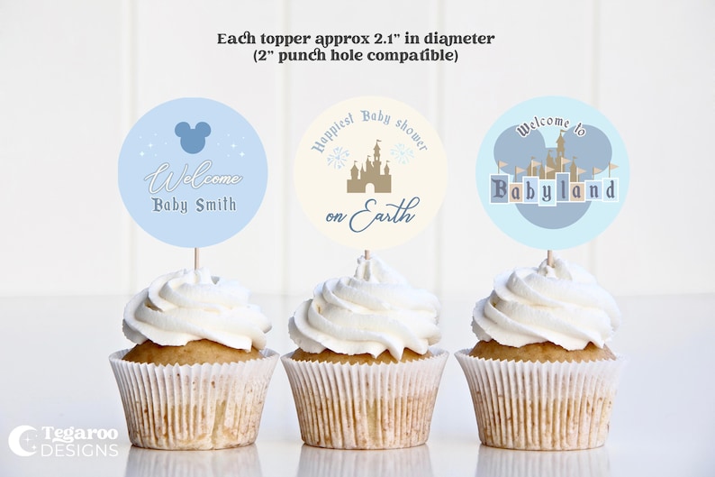 May include: Three cupcakes topped with round toppers for a baby shower. The toppers are approximately 2.1 inches in diameter. One topper says "Welcome Baby Smith", another says "Happiest Baby shower on Earth", and the last says "Welcome to Babyland".
