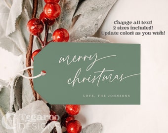 May include: A green gift tag with white text that reads "merry christmas" and "LOVE, THE JOHNSONS". The tag is decorated with a sprig of red berries and green leaves.