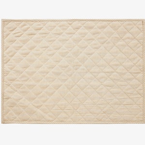 May include: A beige quilted throw pillow with a white gingham pattern. The pillow has a subtle sheen and a soft, textured surface.