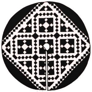 May include: Black and white geometric pattern Christmas tree skirt. The skirt features a repeating pattern of squares and diamonds.