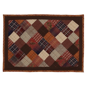May include: A brown, beige, and red plaid quilted placemat with a brown border.