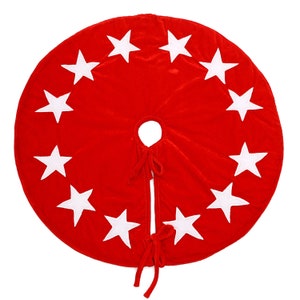 May include: Red velvet Christmas tree skirt with white star accents.