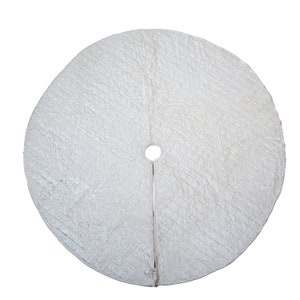 May include: White quilted Christmas tree skirt with a hole in the center for the tree trunk.