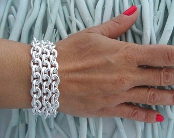 Bracelet femme en argent 925 triple chaîne ovale. Largeur 22 mm, 45 grammes.