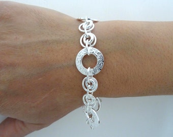 Solid 925 silver bracelet, alternating round links with ''Greek'' texture.