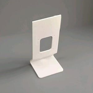 May include: A white, minimalist stand with a rectangular cutout and a base. The stand is made of a smooth, solid material and has a clean, modern design. The stand is designed to hold a device.