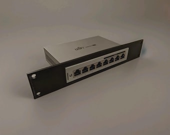 May include: A silver and black network switch with the word "UniFi" printed on the top. The switch has multiple Ethernet ports and is mounted on a black rack panel. The panel has two mounting holes.