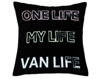May include: Black throw pillow with the text "ONE LIFE", "MY LIFE", and "VAN LIFE" in white, pink, and blue.