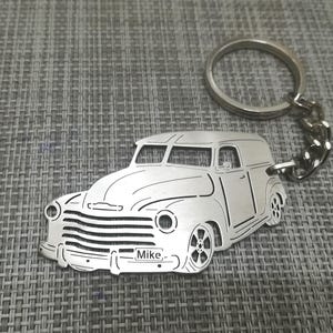 May include: Silver metal keychain featuring a cutout design of a vintage pickup truck with the name "Mike" engraved on the front.