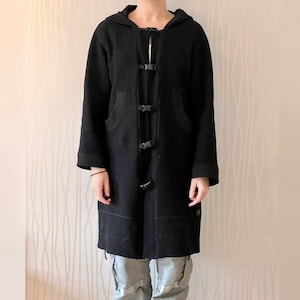 May include: A black hooded long coat with a toggle closure and multiple pockets.