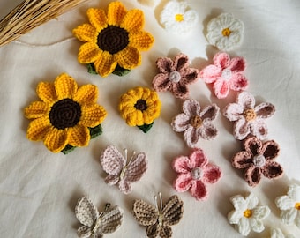 Gehaakte bloemapplicaties: zonnebloem-, madeliefje- en vlinderversieringen (15 stuks)