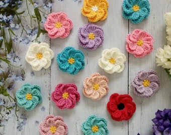 Handgemaakte gehaakte bloemapplicaties: katoenen doe-het-zelfversieringen