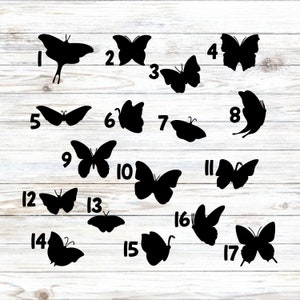 May include: A collection of seventeen distinct black butterfly silhouettes arranged in a grid, each labeled with a corresponding black number from one to seventeen, showcasing various wing shapes and positions on a white wood grain background.