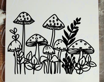 May include: A square white sign featuring a black line art illustration of a cluster of various mushrooms and leafy plants. The design includes several tall and short mushrooms with dotted caps, interspersed with sprigs of foliage and small leaves.