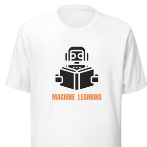 May include: White t-shirt with a black robot reading a book and the text "MACHINE LEARNING" in orange.