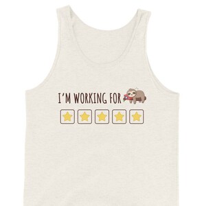 May include: A white tank top with the text "I'M WORKING FOR" and five yellow stars. A cartoon sloth is sleeping on a branch above the stars.