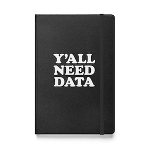 May include: Black leather-bound notebook with the text "Y'ALL NEED DATA" in white.