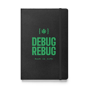 May include: Black notebook with a green bug icon and the text "DEBUG REBUG Such is life".