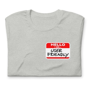 May include: A gray t-shirt with a red name tag that says "HELLO I AM... USER FRIENDLY".