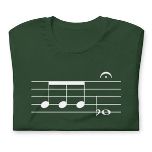 May include: A dark green t-shirt with a white musical note design. The design features four quarter notes and a treble clef.