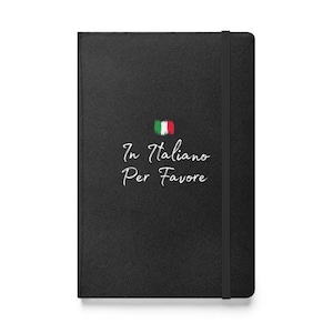 May include: Black leather-bound journal with a white elastic closure. The cover features a white Italian flag and the text "In Italiano Per Favore" in white cursive.