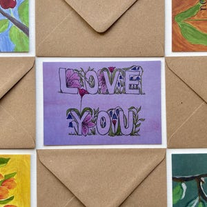 Tarjeta de felicitación &quot;Te amo&quot;. Diseño de acuarela pintado a mano e impreso en papel reciclado, con sobre marrón. Para cualquier ocasión o San Valentín.