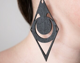 Large diamond earrings in minimalist black wood