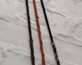 May include: Three wooden wands, one black, one brown, and one red, with intricate details. The wands are all about 12 inches long and are perfect for cosplay or fantasy play.