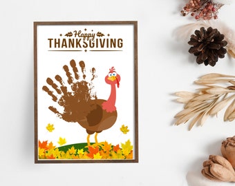 May include: A printable Thanksgiving craft featuring a brown turkey with a red head and a handprint tail. The turkey is standing on a green patch of grass surrounded by orange, yellow, and red leaves. The text "Happy Thanksgiving" is at the top of the page.