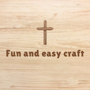 May include: A wooden cross on a light brown wood background with the text "Fun and easy craft".