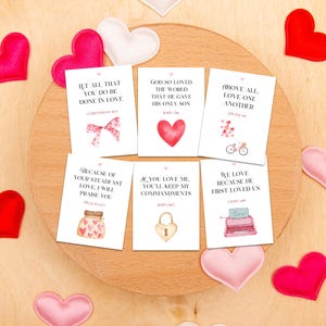 May include: Set of ten printable Valentine's Day cards with pink and red hearts and bible verses. The cards feature quotes such as "Let all that you do be done in love" and "We love because he first loved us".