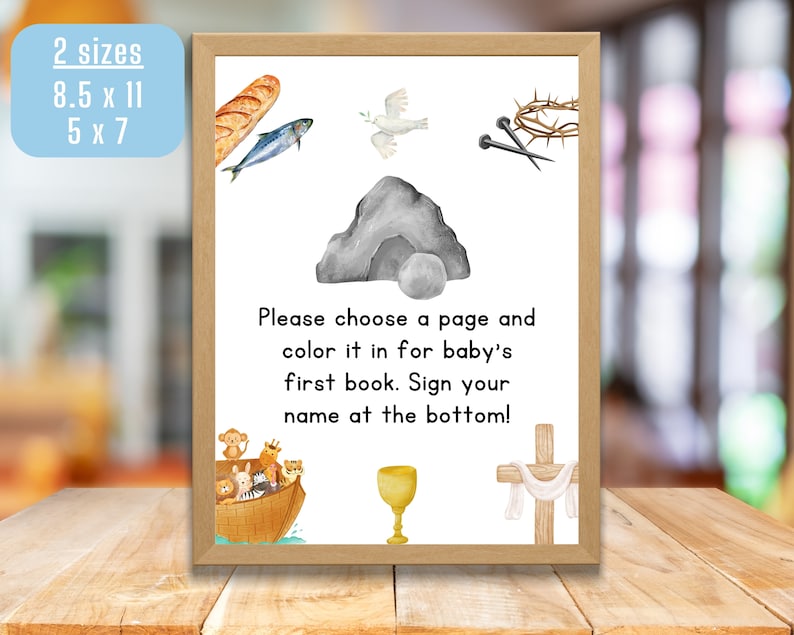 May include: A printable sign with a white background and a brown frame. The sign has a variety of images including a dove, a crown of thorns, a stone, a fish, a chalice, a cross, and a boat with animals. The sign says "Please choose a page and color it in for baby's first book. Sign your name at the bottom!"