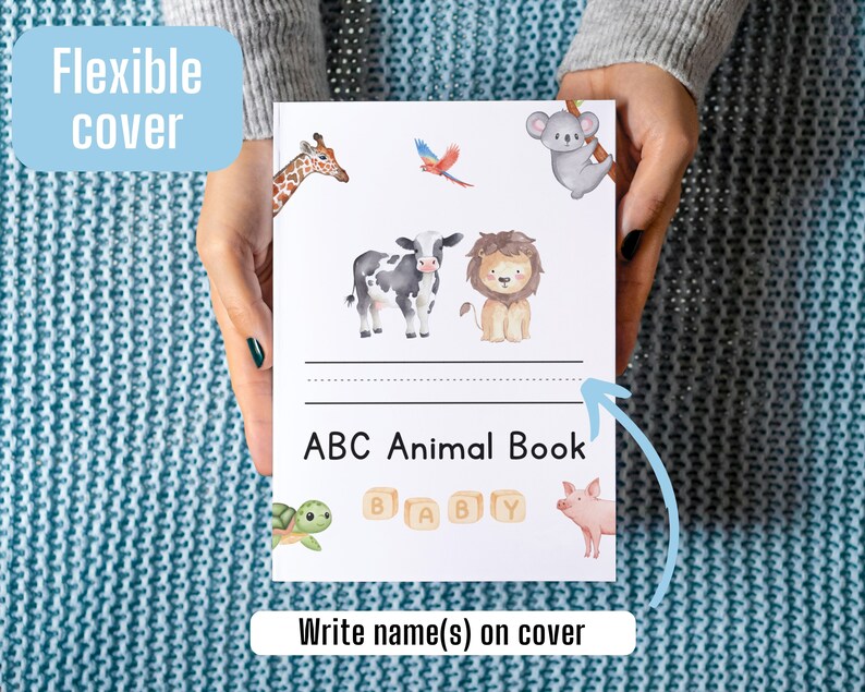 May include: A white book with a flexible cover featuring a colorful illustration of animals. The book title is "ABC Animal Book" and there is space to write a name on the cover.