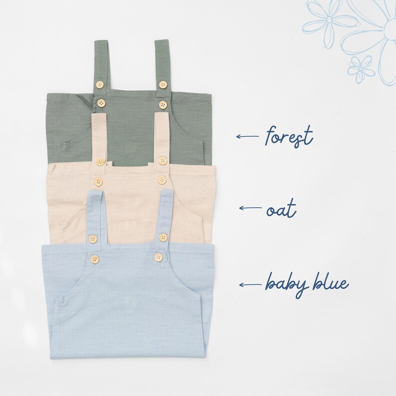 May include: Three sleeveless rompers stacked vertically in forest green, oat beige, and baby blue. Each romper features two shoulder straps with light-colored wooden buttons. Text labels indicate the colors as forest, oat, and baby blue.