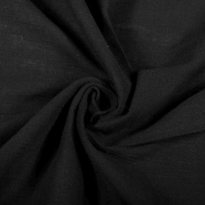 May include: A solid black fabric with a soft, matte texture, featuring deep, swirling folds and natural drapes that create a series of shadows and highlights across the surface, emphasising the consistent dark colour and the pliable nature of the material.
