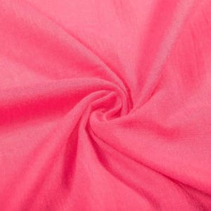 May include: A vibrant hot pink fabric with a soft, fine-knit texture. The material is gathered in the centre, creating natural folds and shadows that highlight the consistent, bright pink colour and the delicate, lightweight weave of the textile.