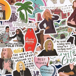 May include: A collection of colorful stickers featuring illustrations and text. Designs include a motel key tag, a building labeled "Apothecary", and various character portraits. Text includes phrases like "You just fold it in!" and "The world is falling apart around us."