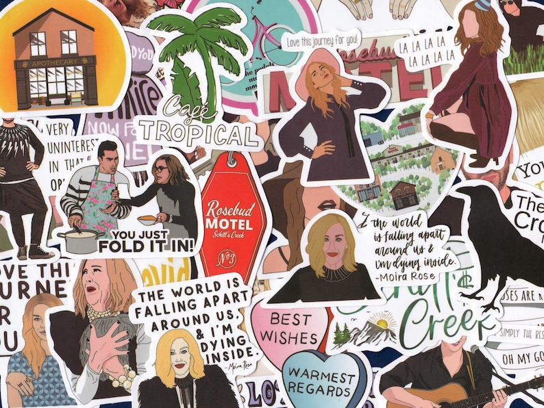May include: A collection of colorful stickers featuring illustrations and text. Designs include a motel key tag, a building labeled "Apothecary", and various character portraits. Text includes phrases like "You just fold it in!" and "The world is falling apart around us."