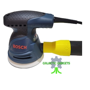 May include: A blue and black Bosch random orbit sander with a yellow dust collection hose. The sander has a white sanding pad and a black power cord. The text "BOSCH" is printed in red on the sander.
