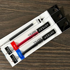 May include: Three Arteza gel pen refills in clear packaging. One refill is red, one is blue, and the others are black. Each package has the text "GEL PEN REFILL" and "MEDIUM POINT 0.7 mm".