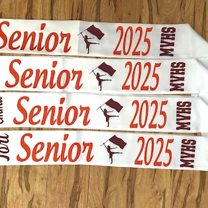 Senior color guard sash with school letters at the end