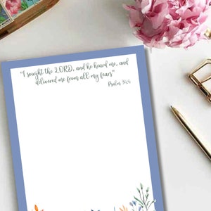 May include: A blue and white printable stationery sheet with a floral border and the quote "I sought the LORD, and he heard me, and delivered me from all my fears" Psalm 34:4.
