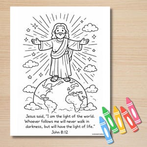 May include: Black and white line drawing of Jesus standing on a globe with arms outstretched, surrounded by rays of light, stars, and clouds. Text at the bottom reads, "I am the light of the world." Crayons are in the bottom right corner.
