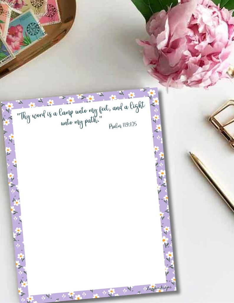 May include: A printable sheet of paper with a light purple background and a white daisy border. The text reads "Thy word is a lamp unto my feet, and a light unto my path." Psalm 119:105