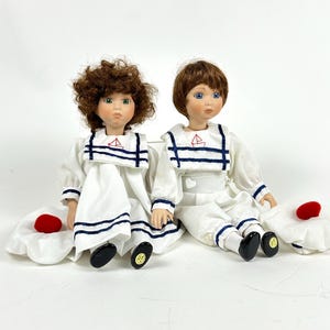 Vintage Porcelain Sailor Doll Pair – 10” Boy & Girl with White Outfits and Hats – Nautical Figurines, Porcelain and Cloth