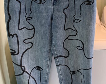 Abstract line drawing faces on denim