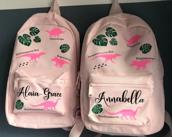 1x Personalised - ONE dinosaur themed children's school backpack. Navy, blue, pink, lilac or pistachio colours available