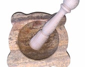 Red travertine mortar with wooden pestle